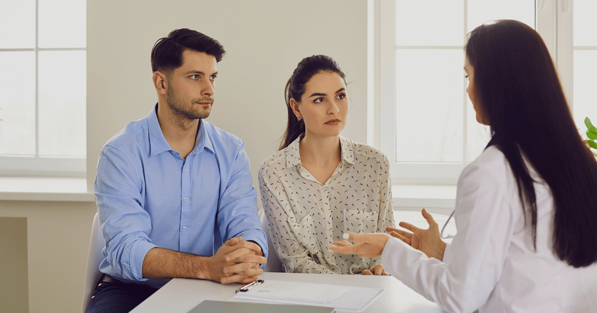 Couple consulting with medical professional on hep-c treatment options